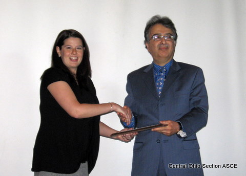 President Emily Wieringa presents Dr. Hojjat Adeli with the award for Outstanding Civil Engineer of Central Ohio